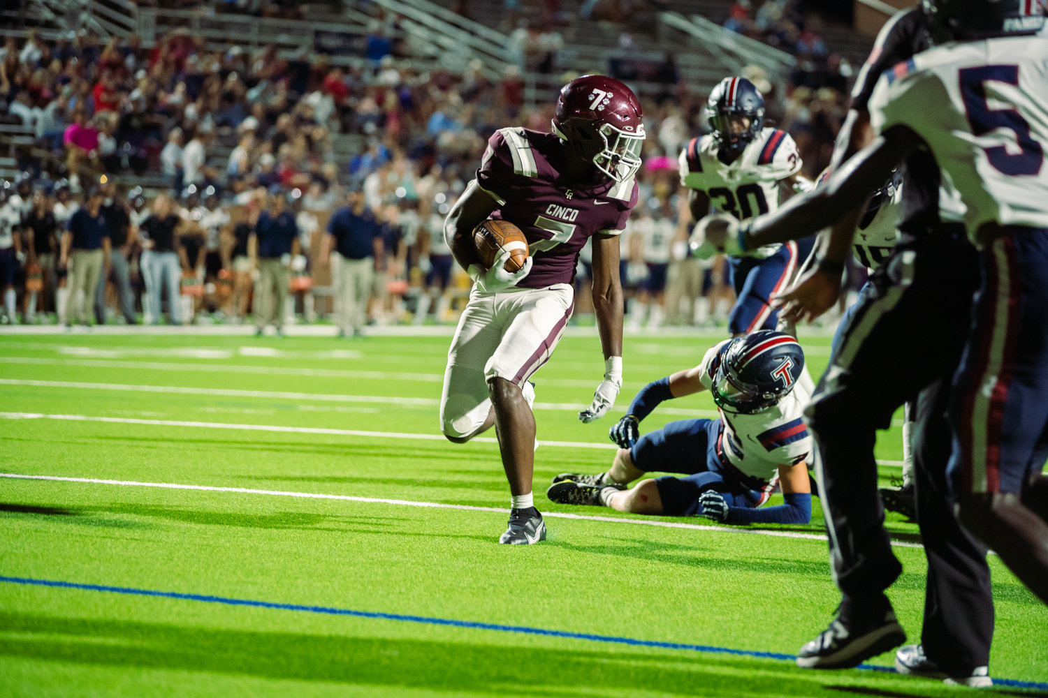 Cinco Ranch’s Sam McKnight runs into the endzone during Friday’s game between Cinco Ranch and Tompkins at Rhodes Stadium.